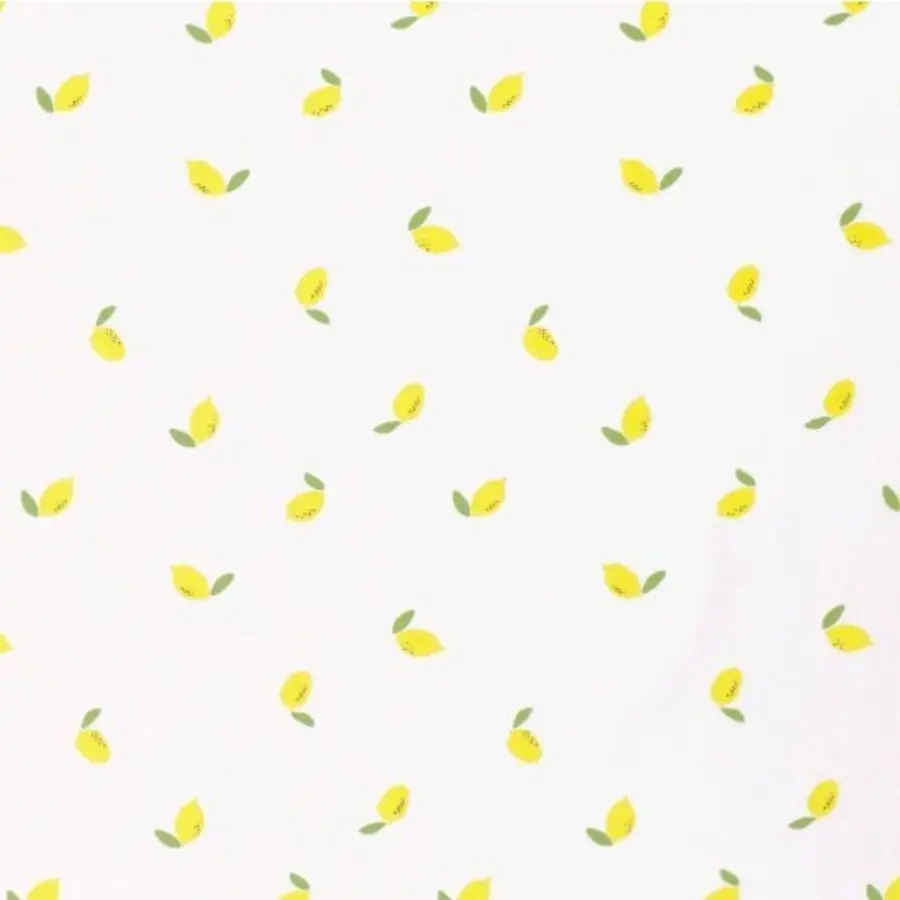 Tissu à motifs citrons jaunes éparpillés sur fond blanc sur le site Johanna Créations