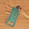 Étui à lunettes vert basilic en velours côtelé avec lunettes de soleil glissées à l'intérieur sur le site Johanna Créations